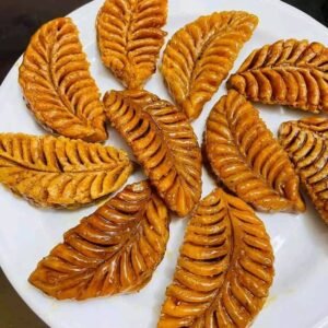 ঝিনুক পিঠা ৬৫০ টাকা কেজি। ( সিরা দেওয়া )