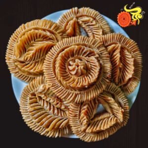 নকশি পিঠা ৬৯০ টাকা কেজি। (সিরা দেওয়া)